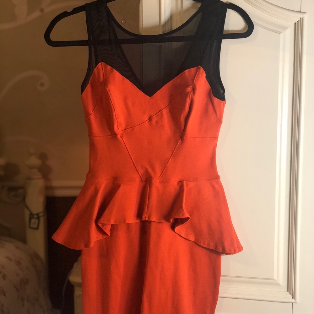 Dark Orange Peplum Dress with Sheer Neckline BEBE